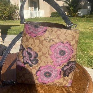 COACH bag with purple flower.